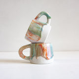 handmade ceramic green, orange, purple and brown mug