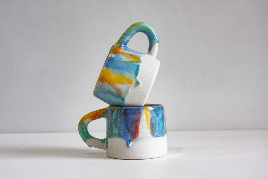 handmade ceramic yellow, green, orange and blue mug 