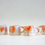 handmade ceramic orange, purple, red and white mug 