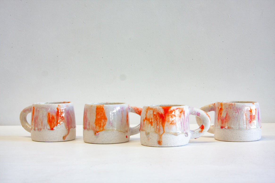 handmade ceramic orange, purple, red and white mug 