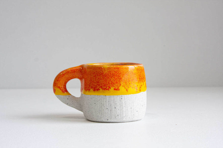 handmade ceramic orange and yellow mug