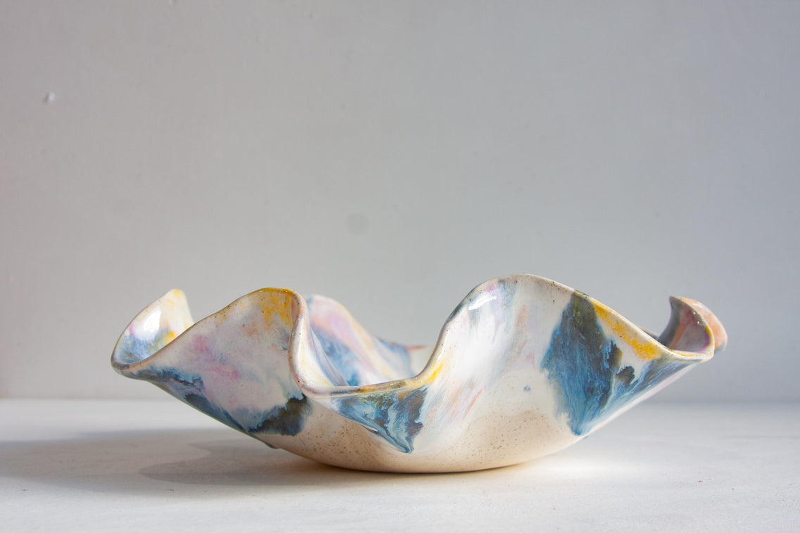 handmade ceramic wavy shaped purple, yellow, peach, blue and white bowl platter