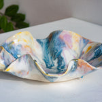 handmade ceramic wavy shaped purple, yellow, peach, blue and white bowl platter