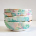 handmade ceramic pasta bowl, glazed in pastel green, peach and purple.