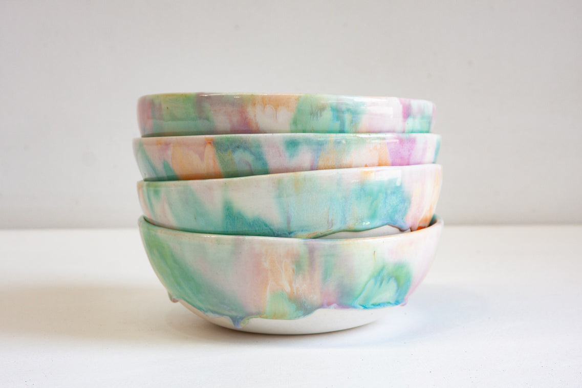 handmade ceramic pasta bowl, glazed in pastel green, peach and purple.
