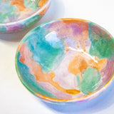handmade ceramic pasta bowl glazed in purple, peach and green.