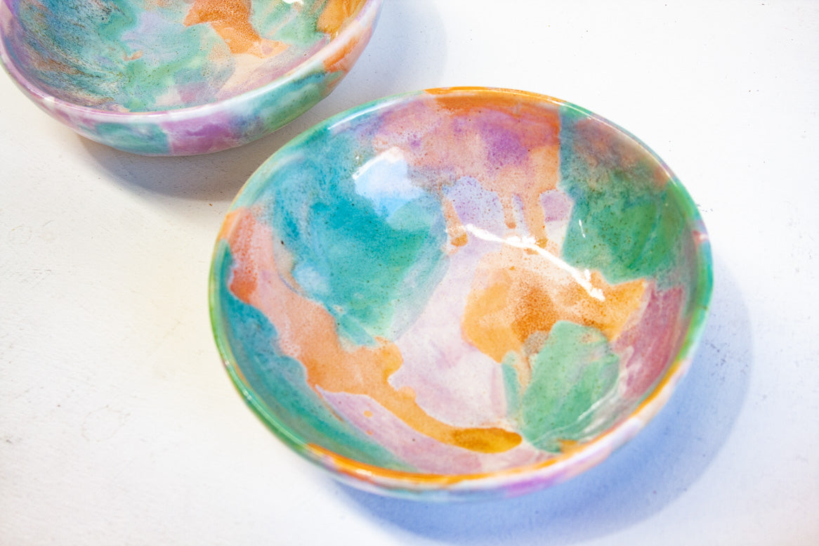 handmade ceramic pasta bowl glazed in purple, peach and green.