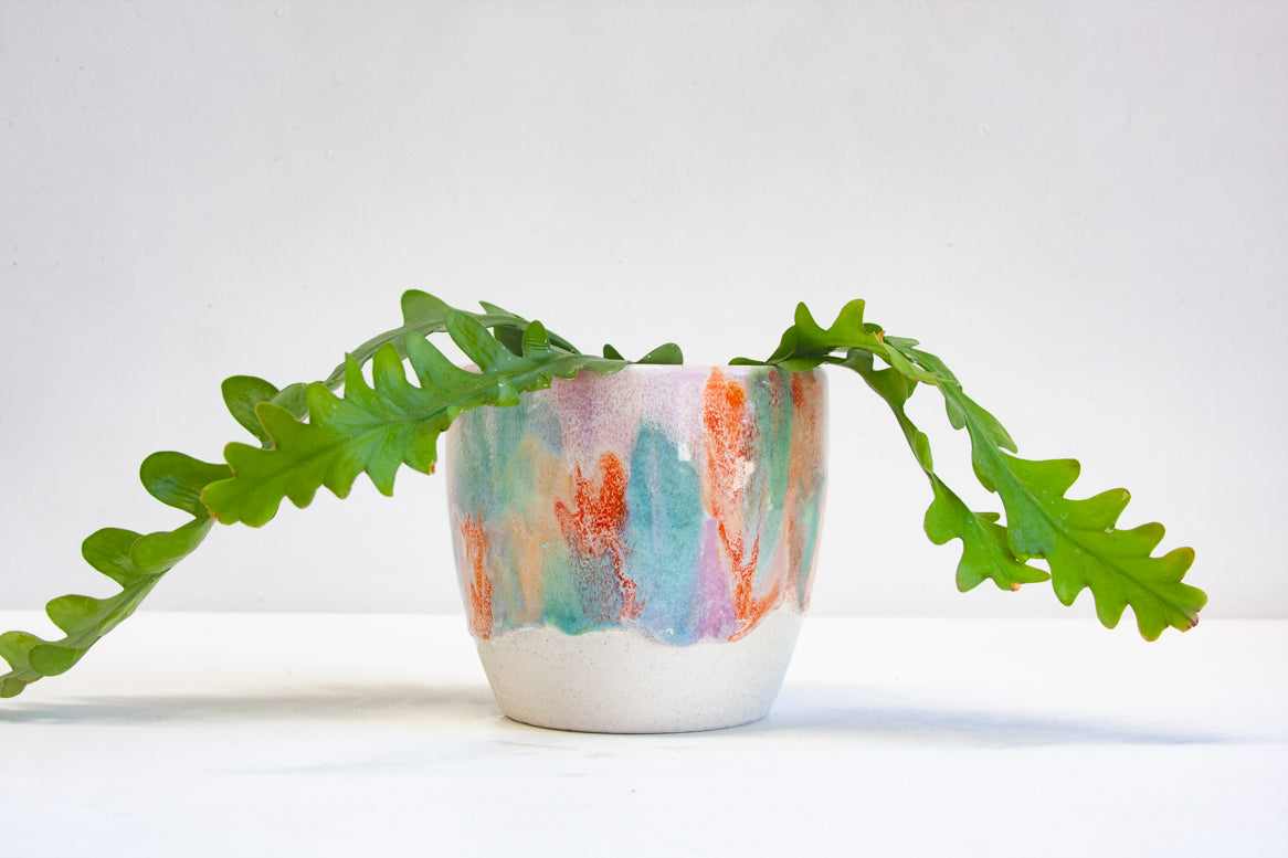 handmade ceramic planter glazed in green, purple, orange and peach