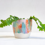 handmade ceramic planter glazed in green, purple, orange and peach