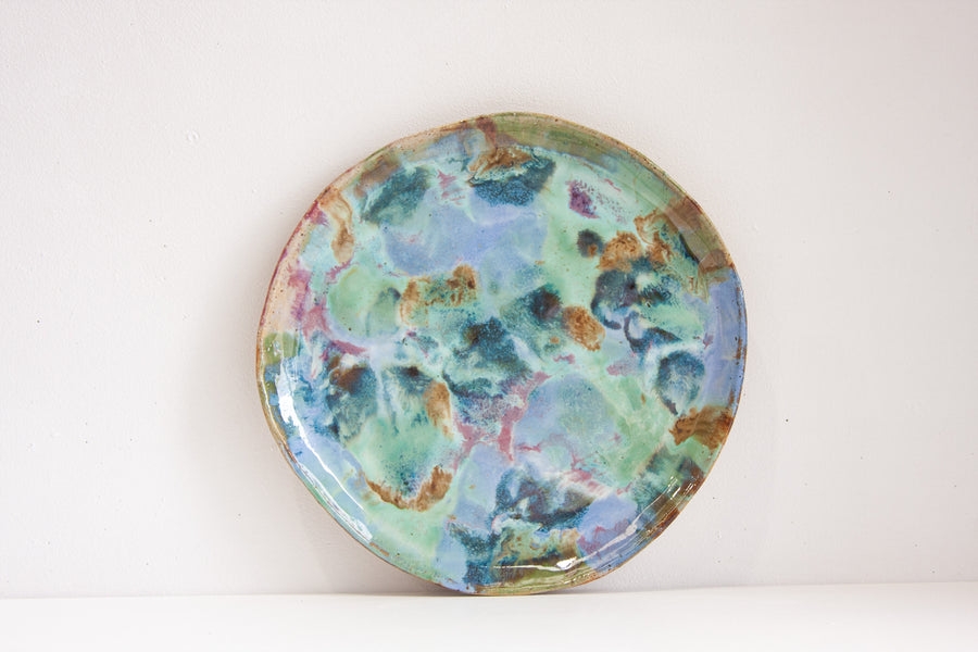 handmade ceramic platter glazed in green, blue, brown amd pink