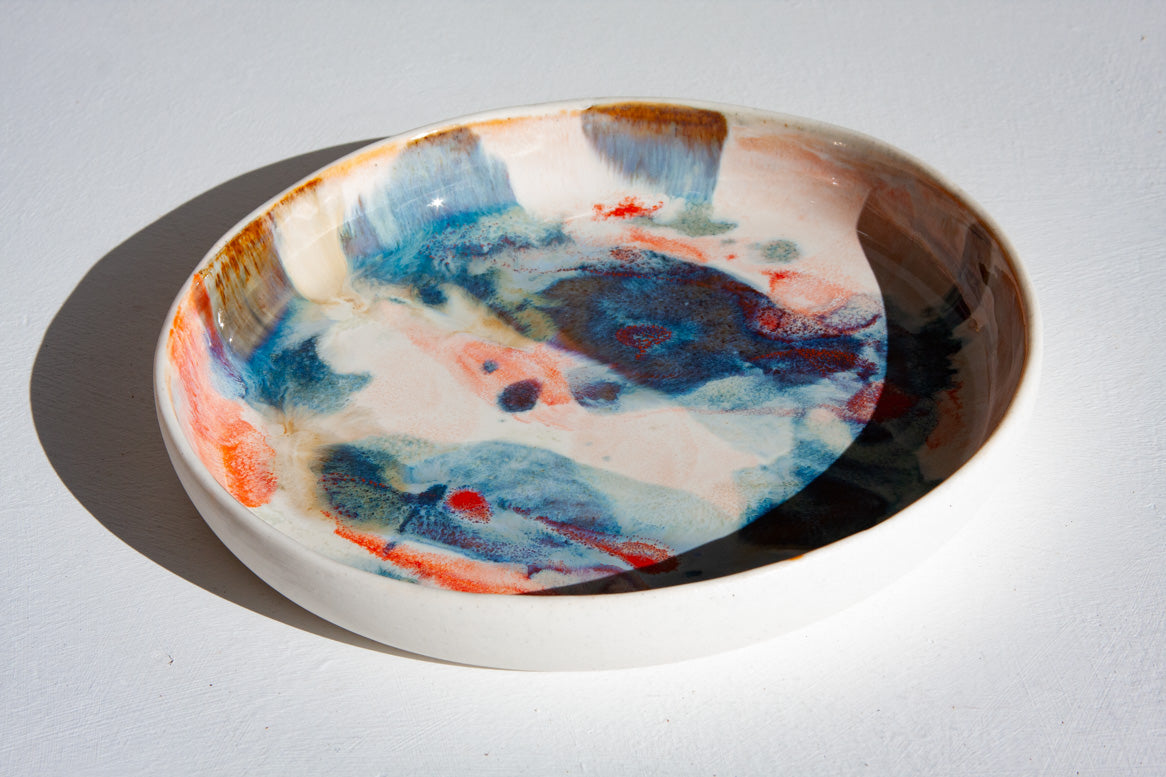 handmade ceramic orange, blue, brown and white deep plate