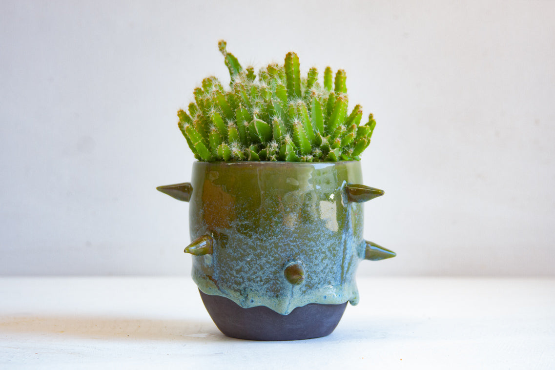 handmade ceramic spiked green vessel