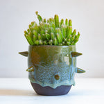 handmade ceramic spiked green vessel