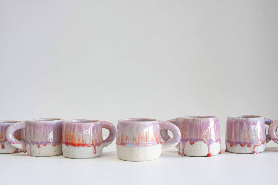 handmade ceramic mug glazed in orange and purple