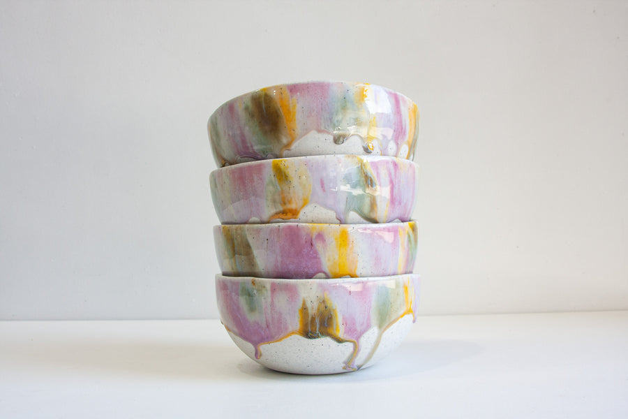 handmade ceramic serving bowl glazed in purple, yellow and blue