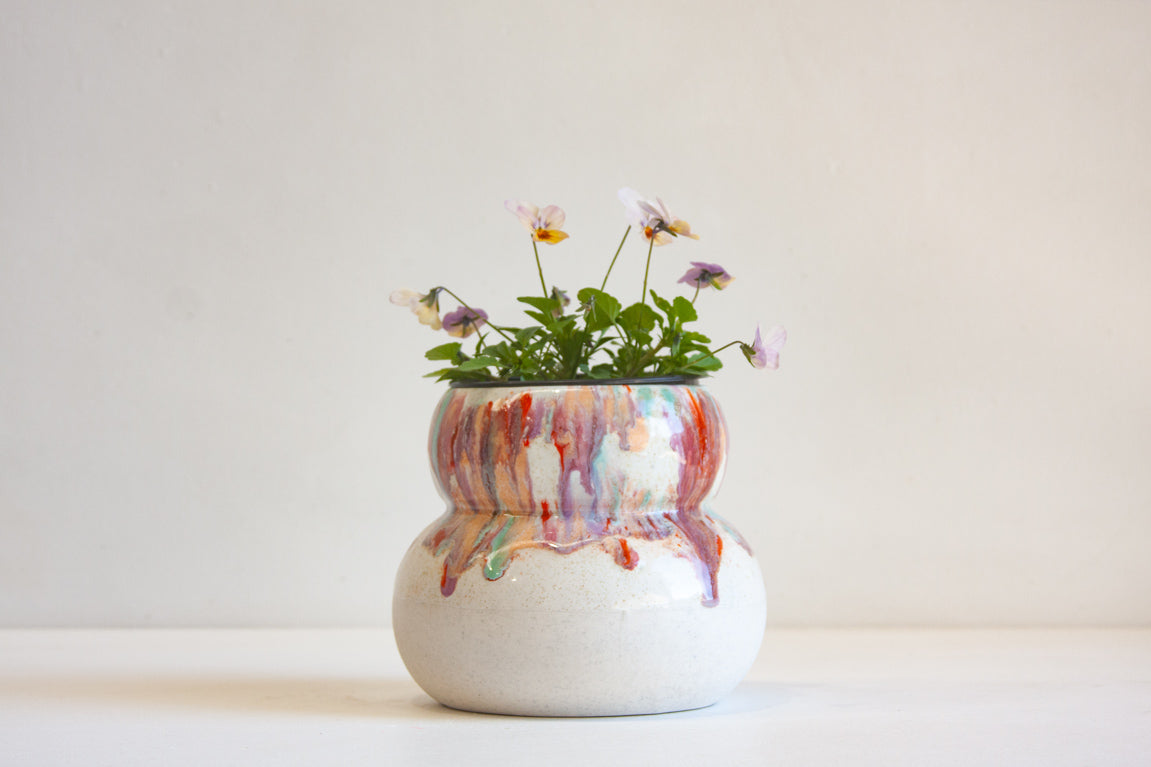 Handmade ceramic sculptural smoosh planter, glazed in pinks, orange and green.