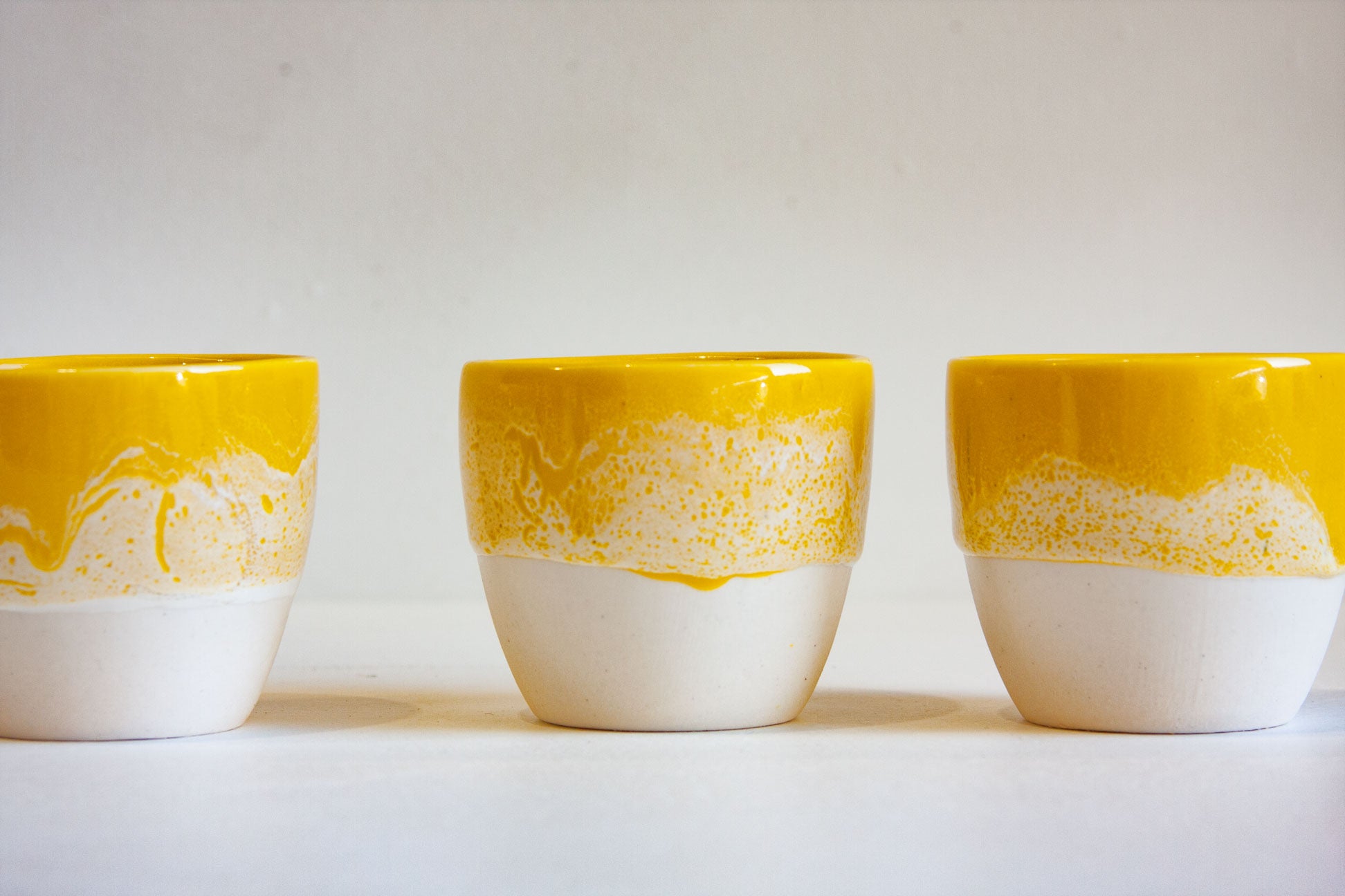 handmade ceramic speckled yellow glazed cup