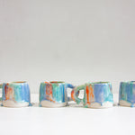 four handmade ceramic drippy glazed mugs