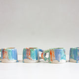 four handmade ceramic drippy glazed mugs
