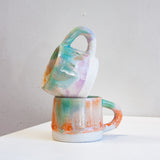 handmade ceramic mug sitting inside another mug.