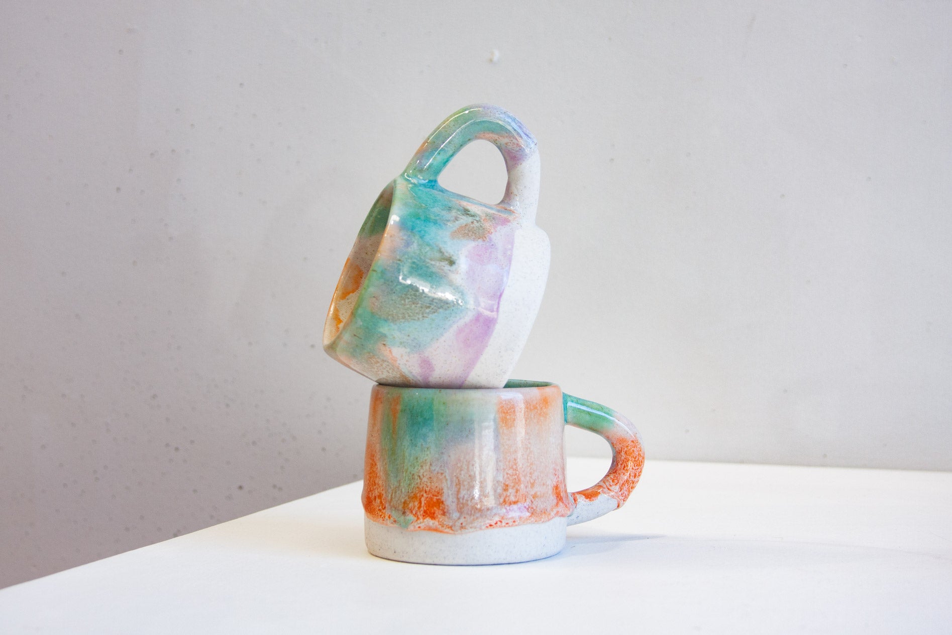 handmade ceramic mug sitting inside another mug.