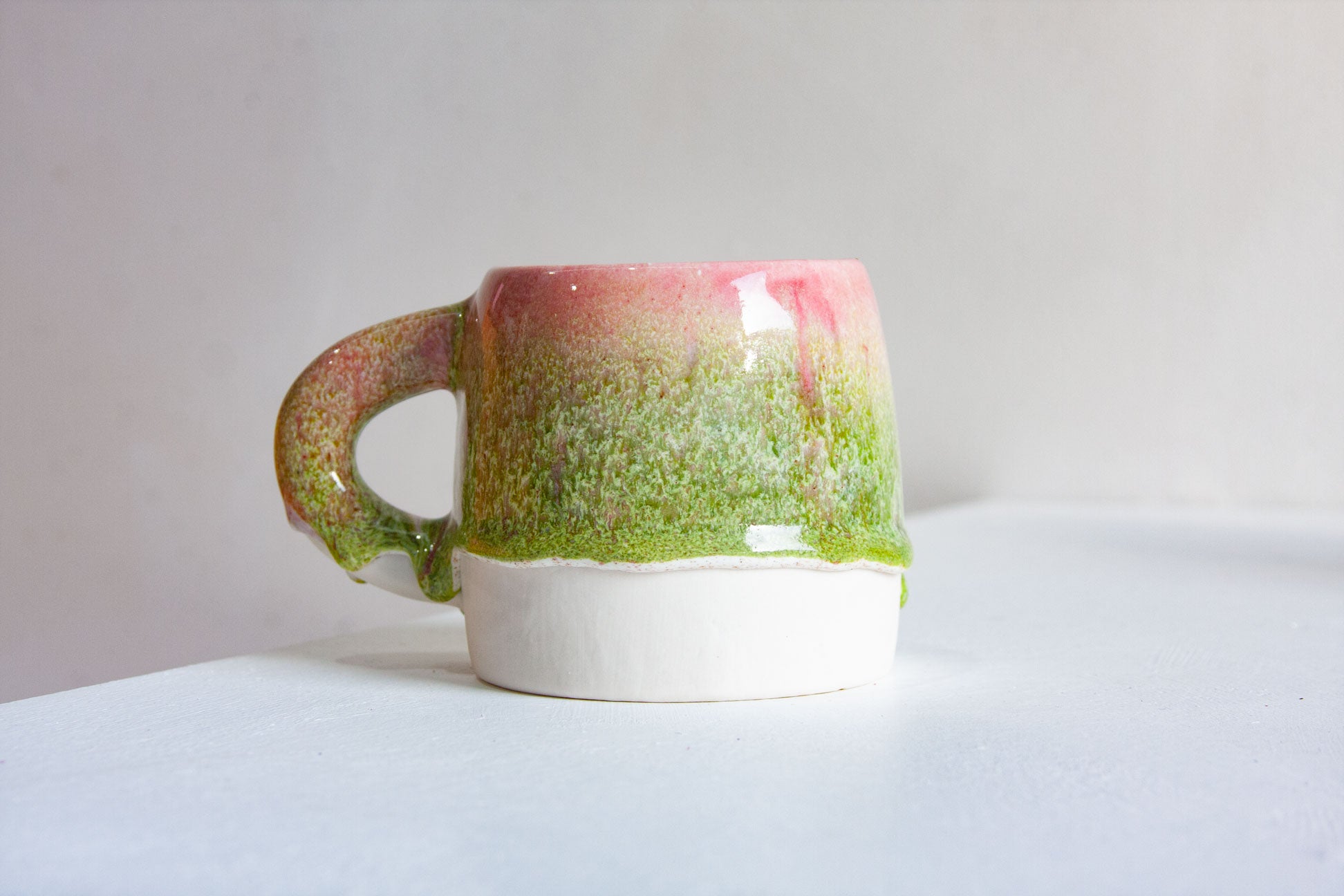handmade ceramic green and pink mug