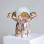 handmade ceramic colourful table lamp on set on a plinth 