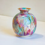 handmade ceramic multicoloured vase on a table