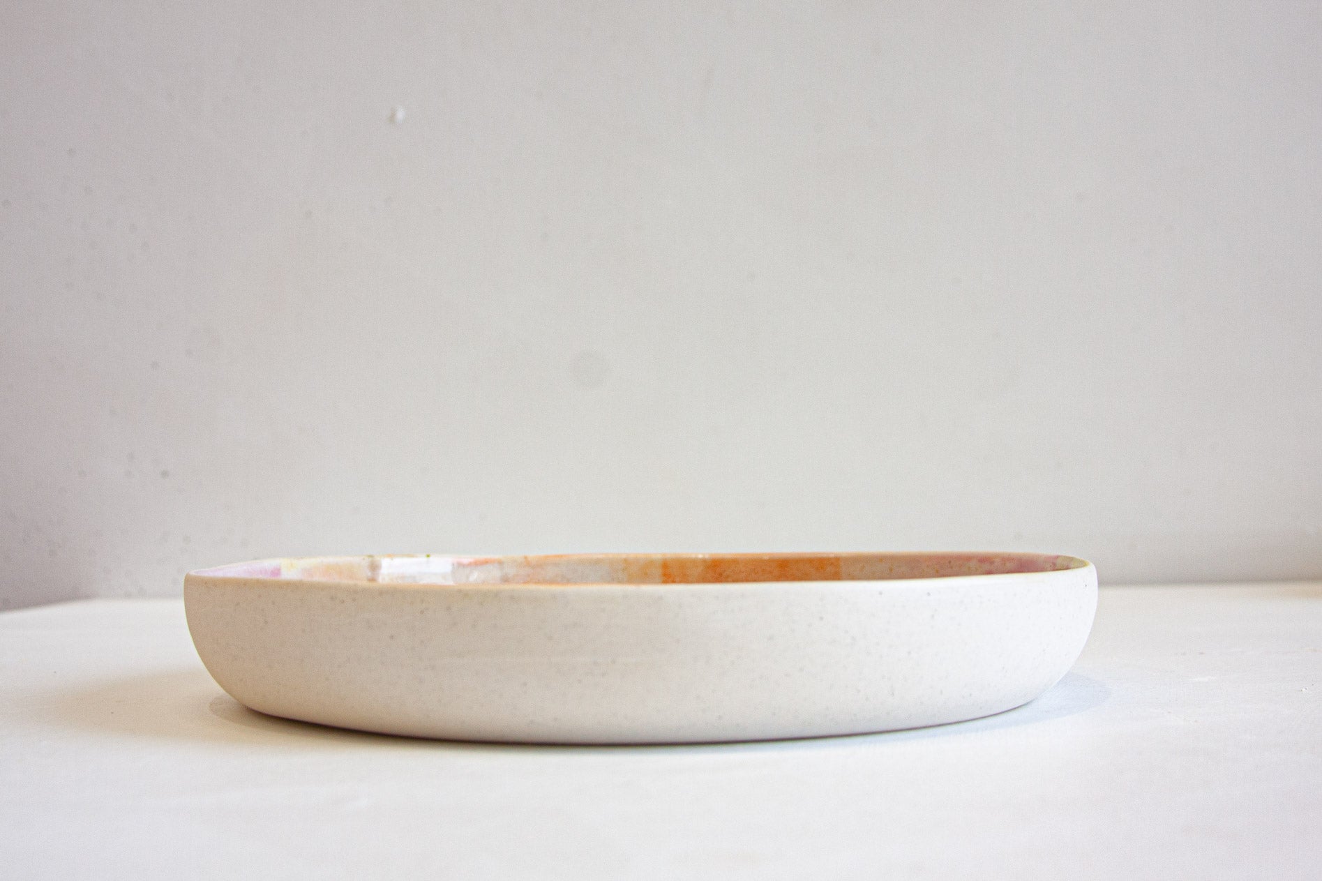 side on view of the handmade ceramic deep plate