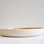 side on view of the handmade ceramic deep plate