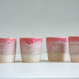 four handmade ceramic espresso cups glazed in speckled pink
