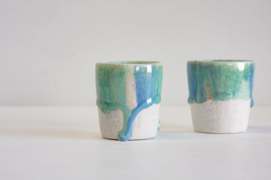 handmade ceramic espresso cup glazed in peach, green and blue 