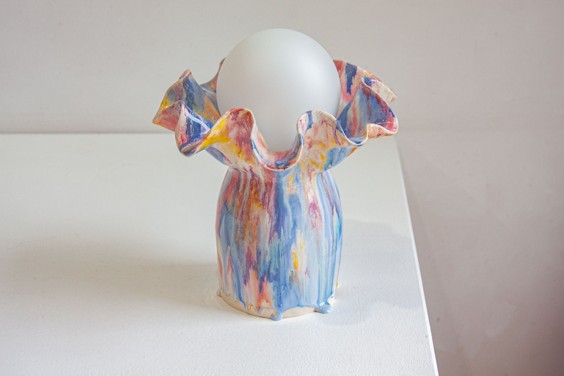 handmade ceramic sculptural table lamp on table