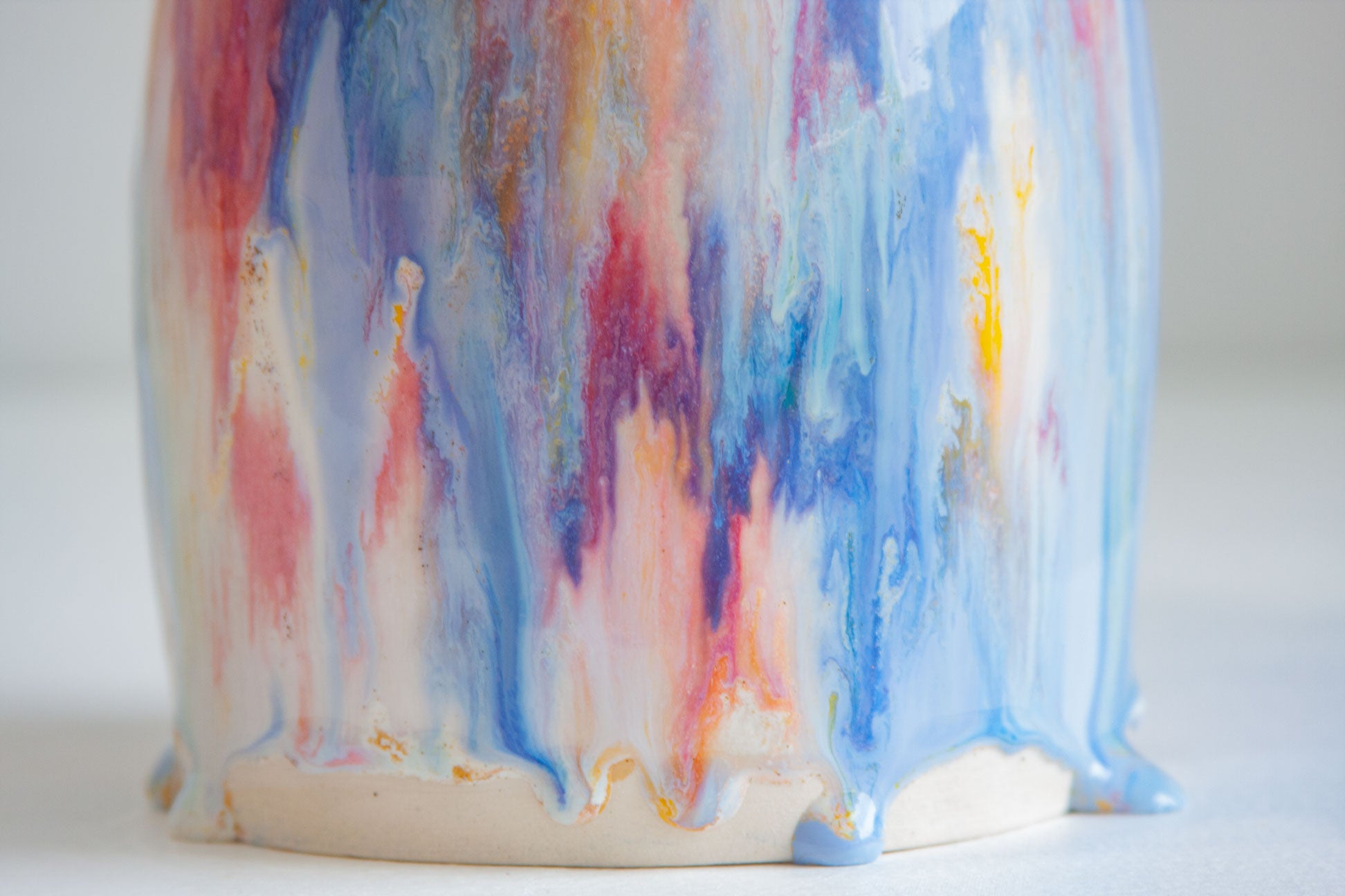 close up of glaze drips on the base of handmade ceramic table lamp