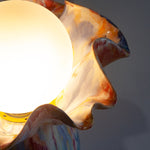 handmade ceramic table lamp shown with light on