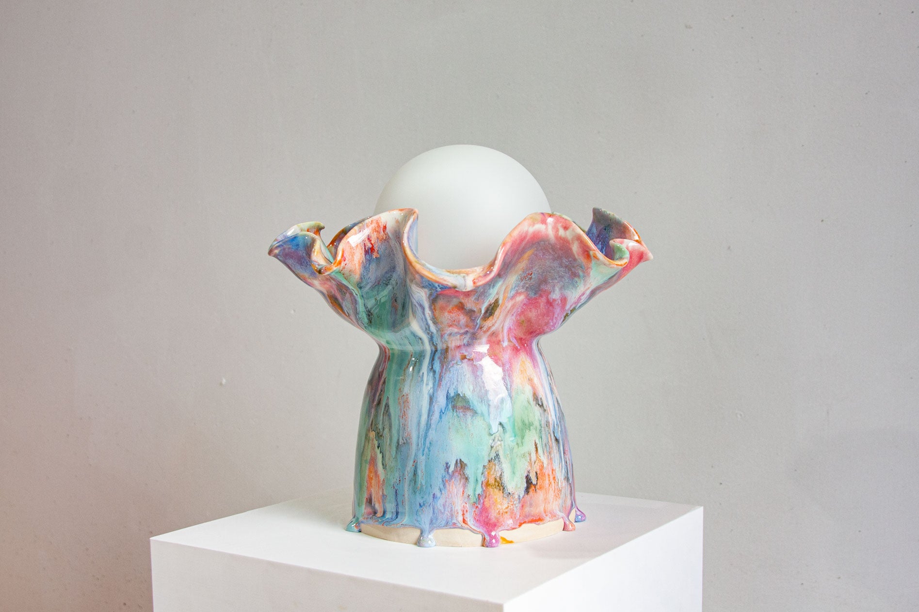 handmade ceramic table lamp on a plinth
