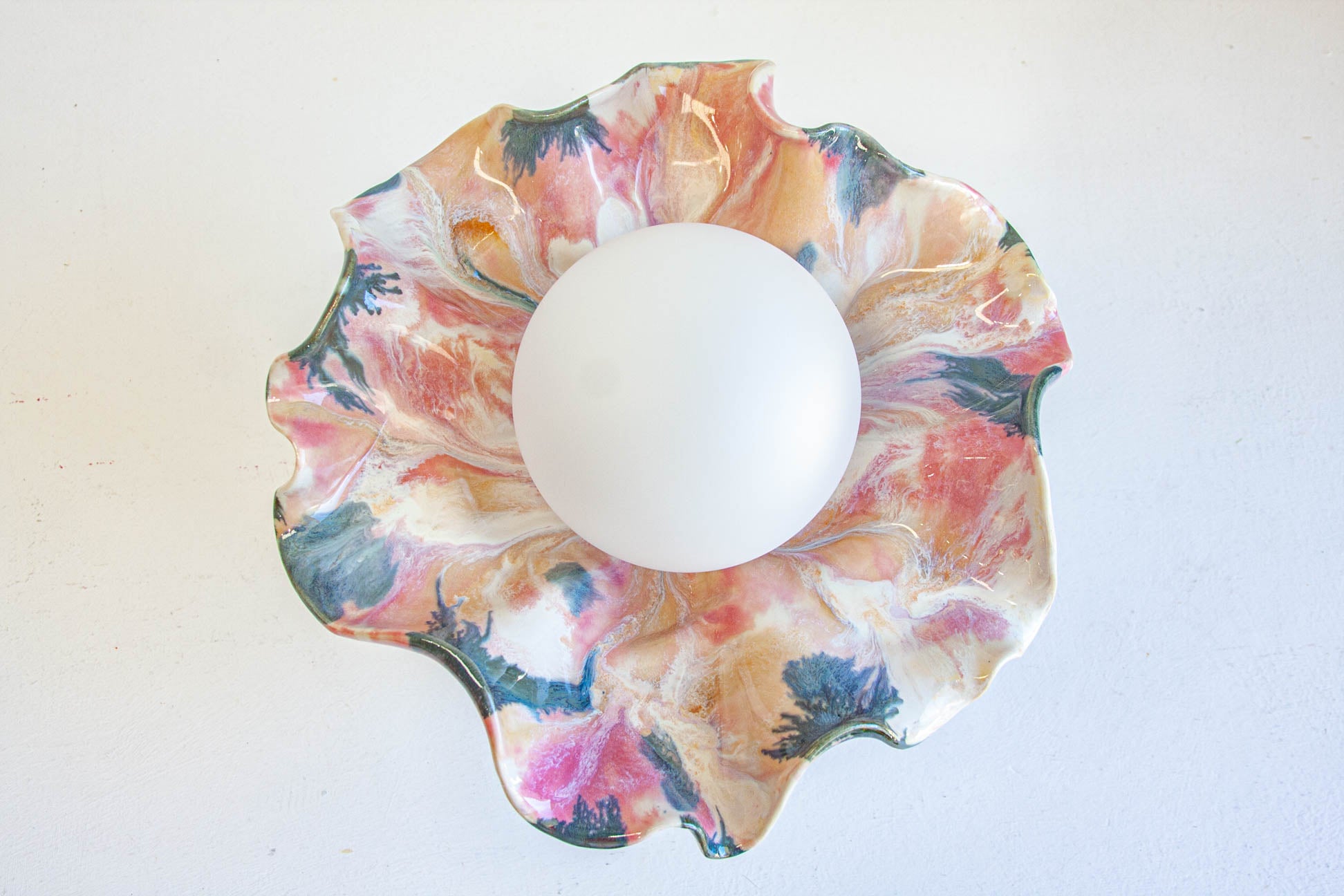 handmade ceramic table lamp, picture taken from above so to capture the glaze and the ripples of the lamp