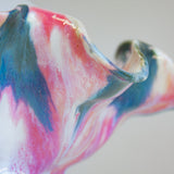 zoomed in picture of the pink, blue, peach and white glaze on ceramic table lamp