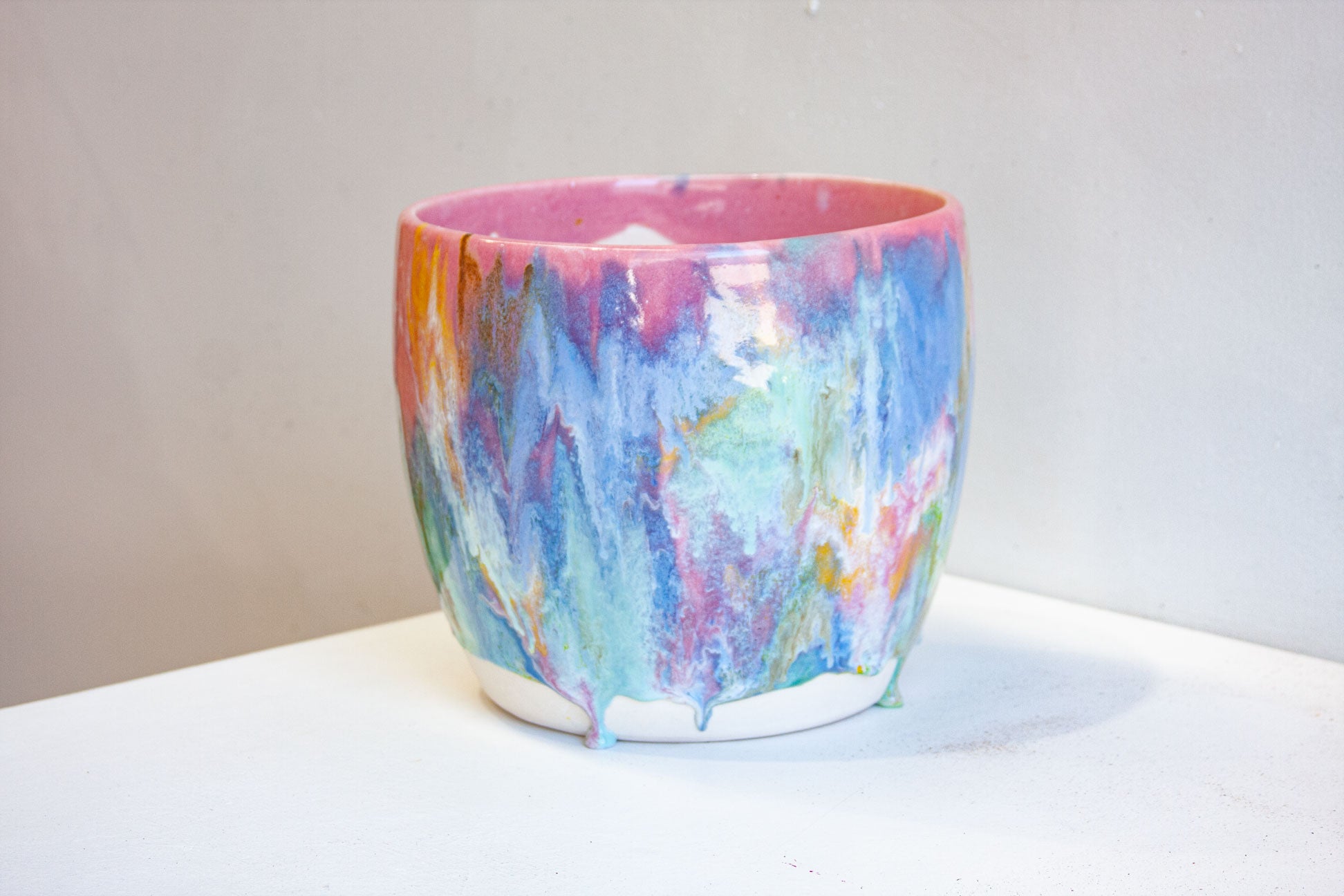 handmade ceramic pink, blue, green, yellow, brown and white glazed planter.