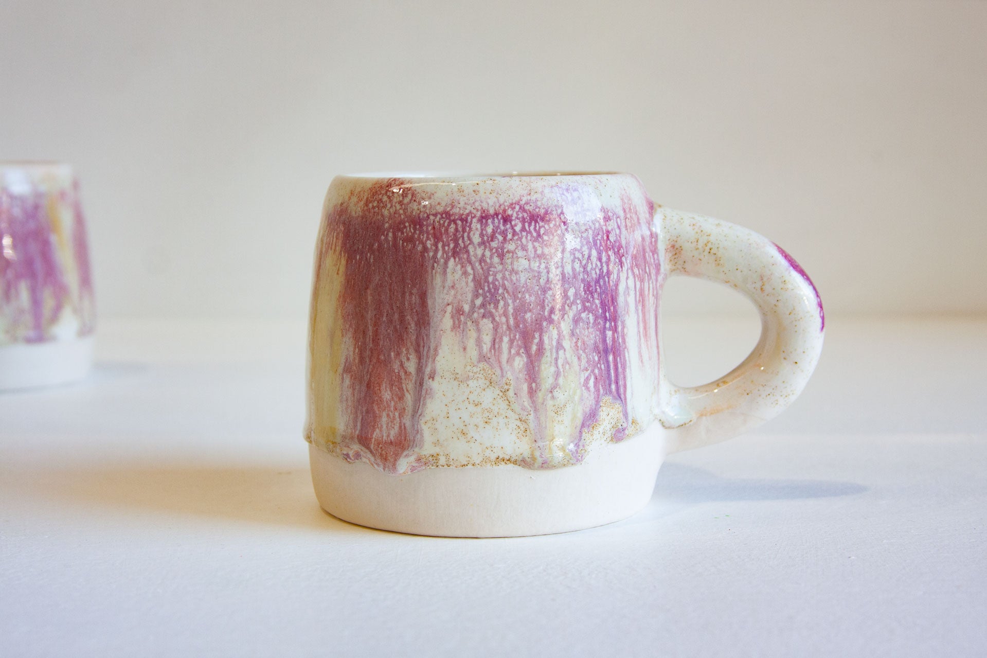 handmade ceramic mug on a white table