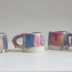 four handmade ceramic pink, peach and blue mug 