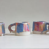four handmade ceramic pink, peach and blue mug 