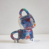 handmade ceramic mugs, one on top of each other.