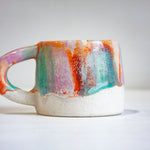 handmade ceramic single orange, purple and green mug 