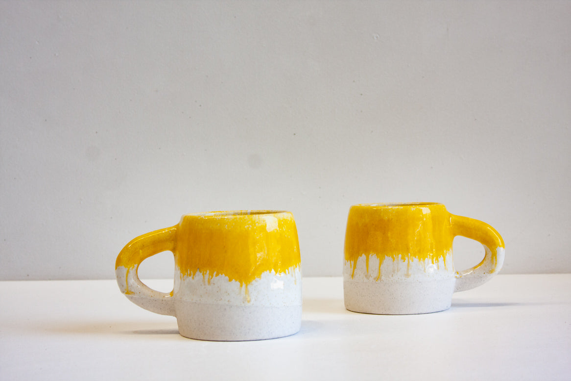 handmade yellow and white ceramic mug