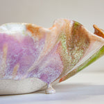 close up of glaze drip on ceramic frilly oyster bowl platter