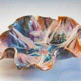 handmade ceramic platter glazed in blue, brown, peach and blue.