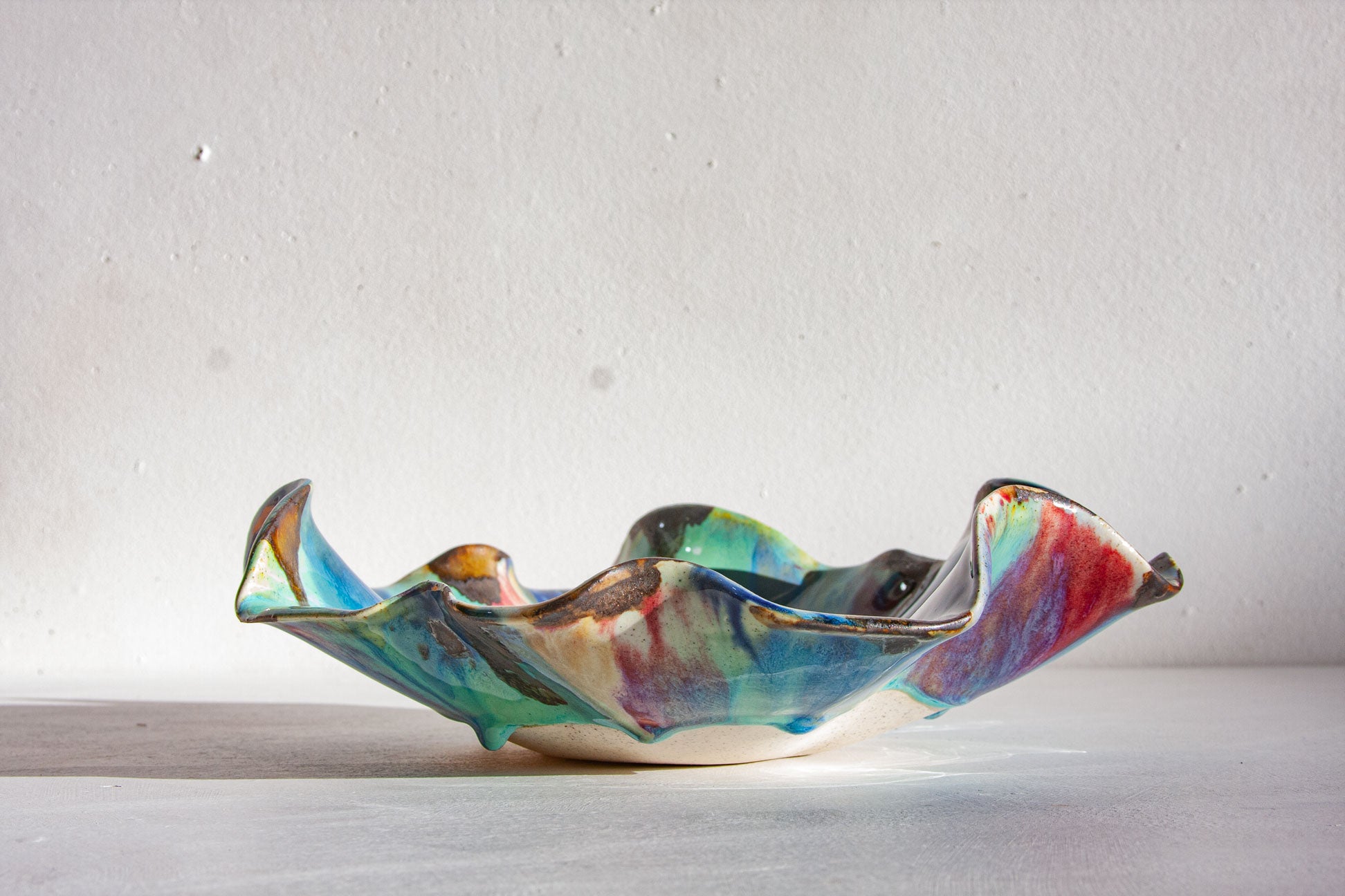 handmade ceramic decorative platter shown from the side