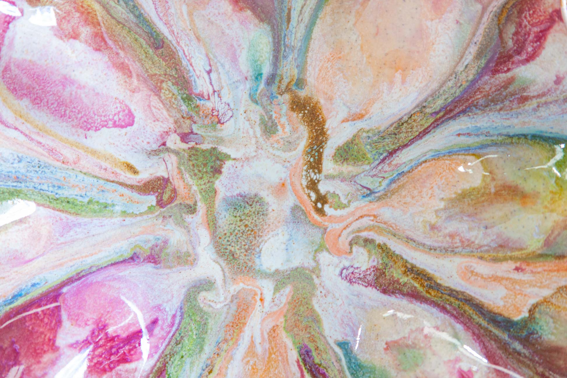 Abstract fluid art print featuring a radial pattern of swirling pastel pink, peach, green, blue, and white paint with fine glittery gold flecks.