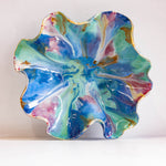 Colourful ceramic oyster plate on a white background